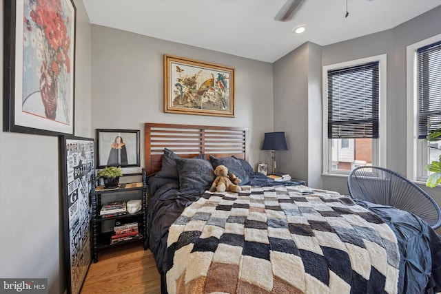 bedroom with recessed lighting and wood finished floors