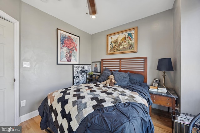 bedroom with baseboards, recessed lighting, ceiling fan, and light wood-style floors