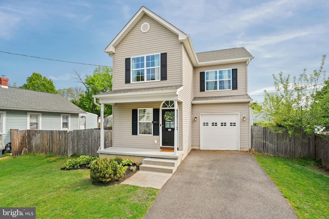traditional-style home featuring fence, a front lawn, aphalt driveway, a garage, and a porch