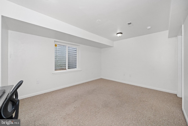 interior space with baseboards, carpet, and visible vents
