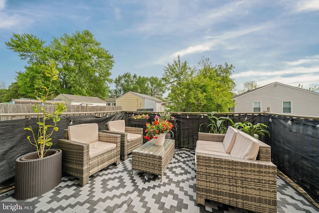 view of patio / terrace featuring fence and an outdoor hangout area