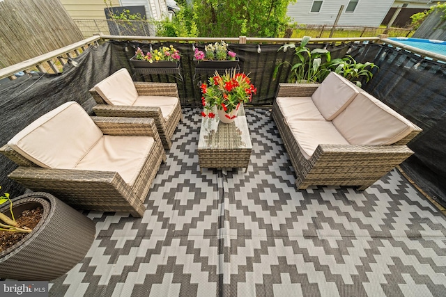 balcony with an outdoor hangout area