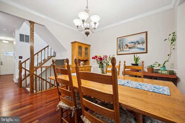 20003 Mattingly Ter, Gaithersburg, MD 20879 - dining space featuring wood finished floors, crown molding, a chandelier, and stairs