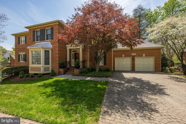 view of front of house featuring brick siding, an attached garage, decorative driveway, a front lawn, and a standing seam roof