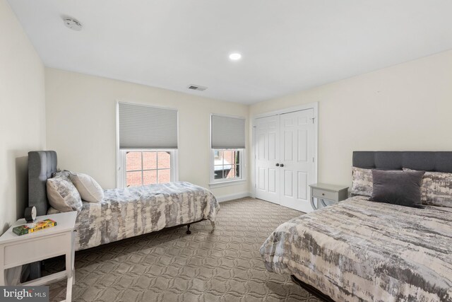 bedroom with carpet flooring and a closet