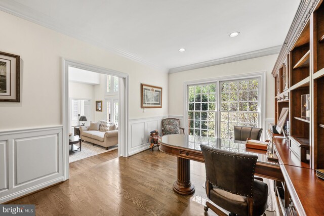 office area featuring wainscoting, a decorative wall, ornamental molding, wood finished floors, and recessed lighting