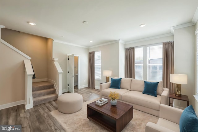 living room featuring crown molding, stairs, wood finished floors, baseboards, and recessed lighting