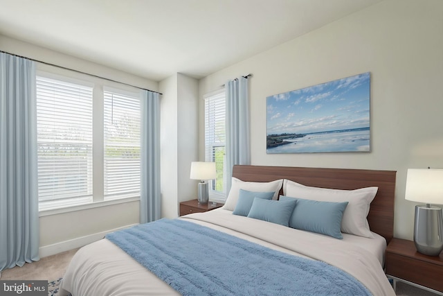 bedroom with carpet flooring and baseboards