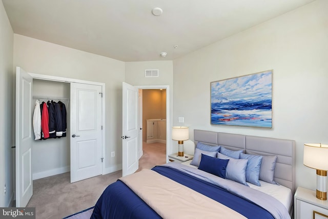 bedroom featuring visible vents, baseboards, a closet, and light colored carpet