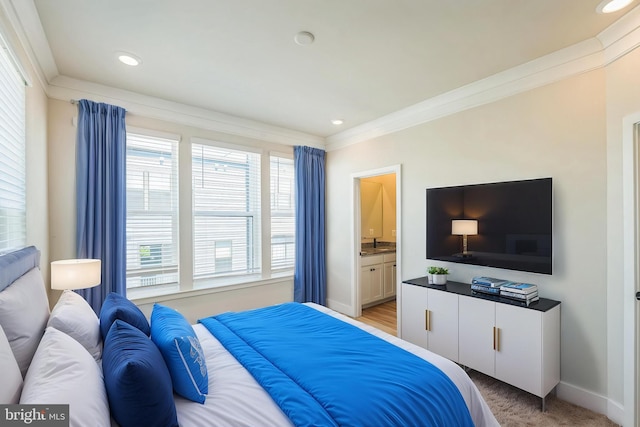 bedroom featuring crown molding, light carpet, baseboards, ensuite bathroom, and recessed lighting