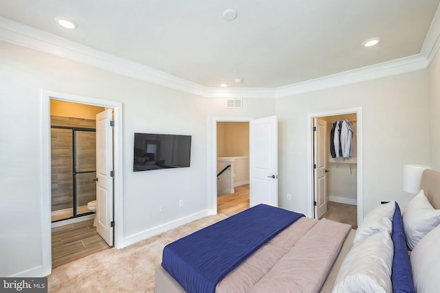 bedroom featuring visible vents, ornamental molding, baseboards, recessed lighting, and a spacious closet