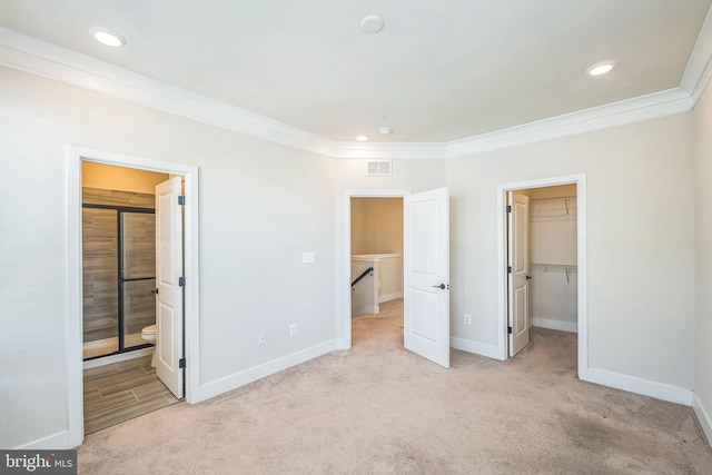 unfurnished bedroom featuring visible vents, ornamental molding, and baseboards
