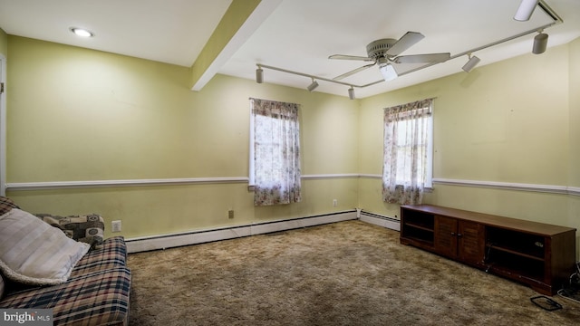 unfurnished room featuring carpet floors, a ceiling fan, rail lighting, and a baseboard heating unit