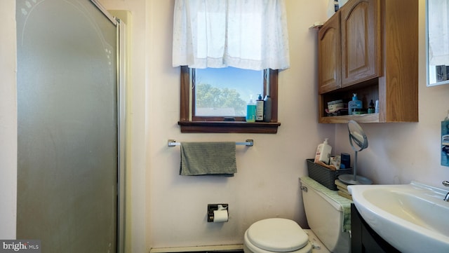 full bath with vanity, a baseboard radiator, an enclosed shower, and toilet
