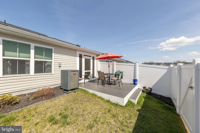 112 Maury Way, Winchester, VA 22602 - wooden terrace featuring a yard, outdoor dining area, central AC unit, and a fenced backyard