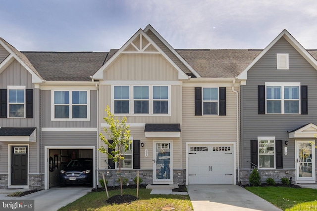 112 Maury Way, Winchester, VA 22602 - view of property featuring a shingled roof, an attached garage, stone siding, board and batten siding, and driveway