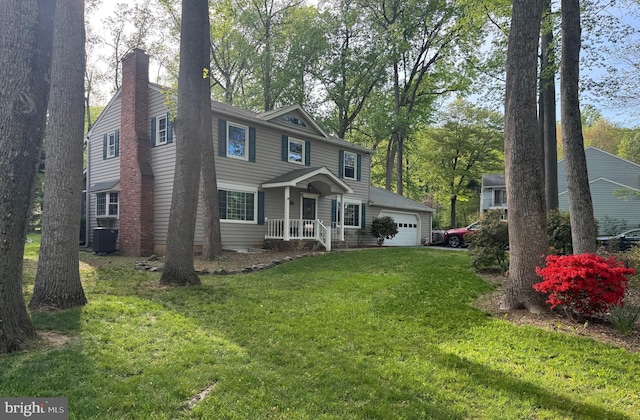colonial-style house featuring central AC unit, a chimney, and a front lawn