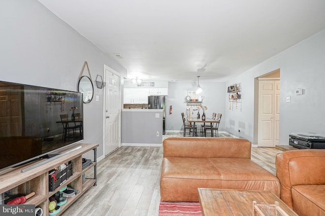 living room with light wood-style floors