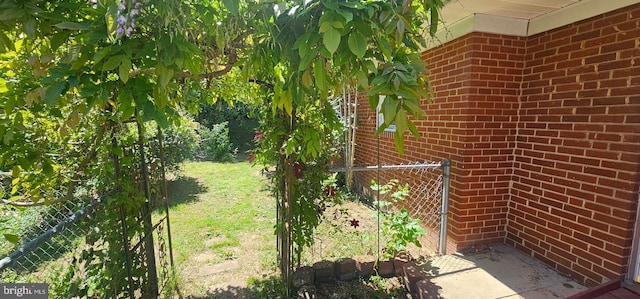 view of yard with fence and a gate