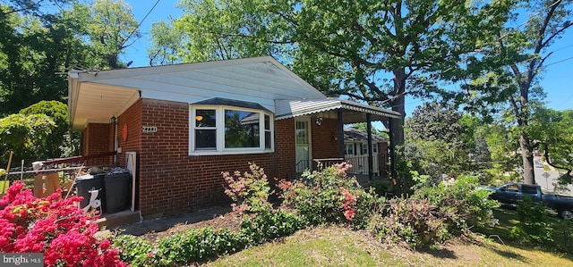 view of side of home featuring brick siding