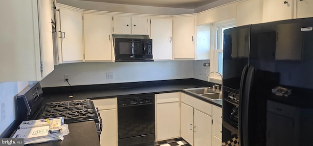 kitchen featuring white cabinetry, black appliances, dark countertops, and a sink