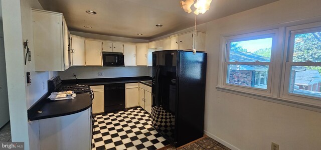 kitchen featuring recessed lighting, tile patterned floors, black appliances, dark countertops, and baseboards