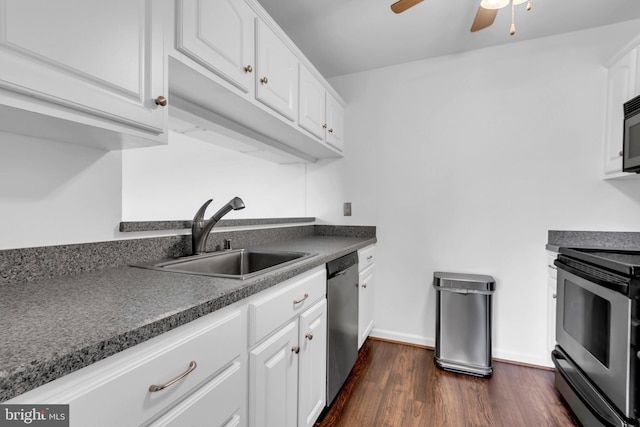 6703 Rapid Water Way Unit 203, Glen Burnie, MD 21060 - kitchen with white cabinets, dark countertops, appliances with stainless steel finishes, and a sink