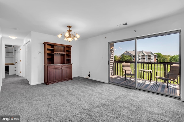 6703 Rapid Water Way Unit 203, Glen Burnie, MD 21060 - unfurnished living room featuring a chandelier, baseboards, visible vents, and carpet