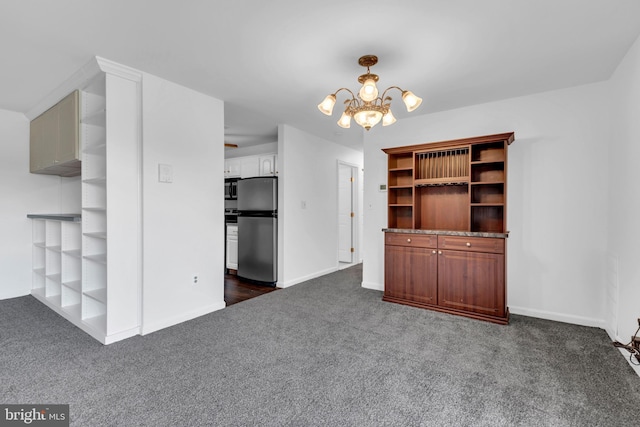 6703 Rapid Water Way Unit 203, Glen Burnie, MD 21060 - unfurnished living room featuring dark carpet, baseboards, and a chandelier