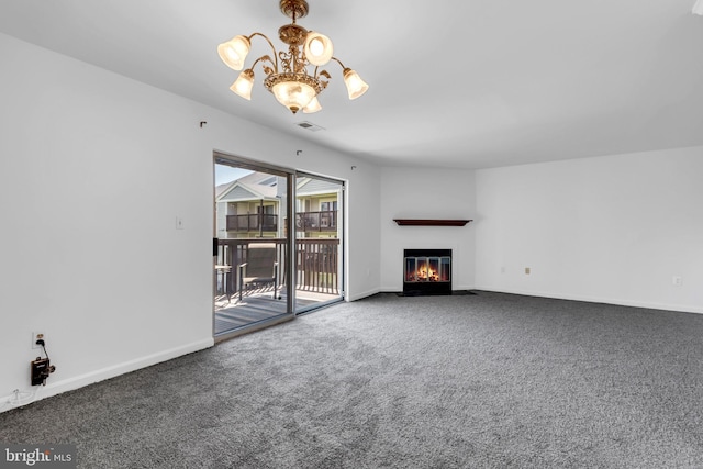 6703 Rapid Water Way Unit 203, Glen Burnie, MD 21060 - unfurnished living room with visible vents, a fireplace with flush hearth, baseboards, a notable chandelier, and carpet flooring