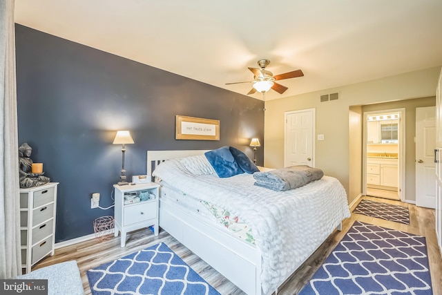 10 Shawnee Ln, Royersford, PA 19468 - bedroom featuring wood finished floors, baseboards, ceiling fan, and connected bathroom