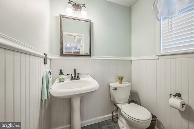10 Shawnee Ln, Royersford, PA 19468 - bathroom featuring toilet, wainscoting, and a sink