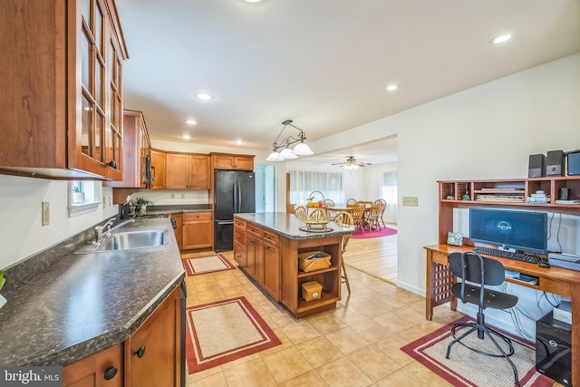 10 Shawnee Ln, Royersford, PA 19468 - kitchen with freestanding refrigerator, open shelves, brown cabinets, dark countertops, and a sink