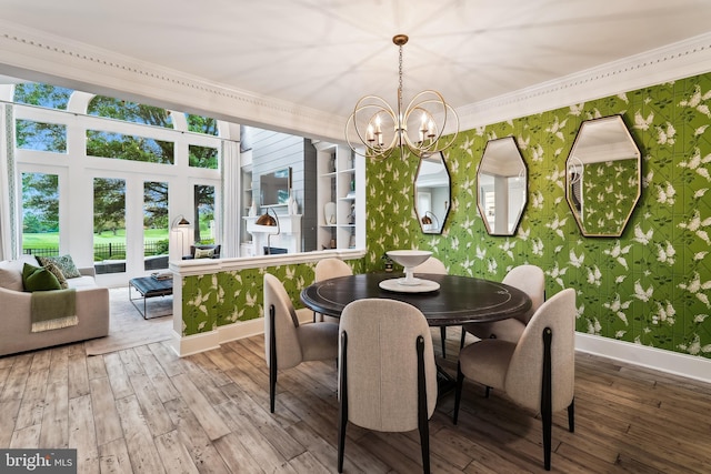 sunroom featuring a chandelier