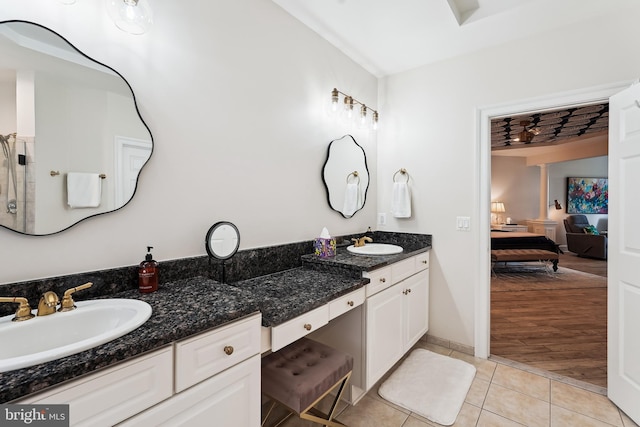 full bathroom featuring ensuite bath, tile patterned flooring, and double vanity