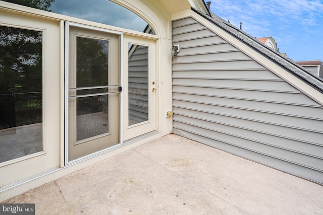 doorway to property with a patio area
