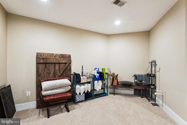 living area with carpet flooring, recessed lighting, and baseboards
