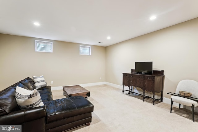 living area featuring recessed lighting, baseboards, and light carpet