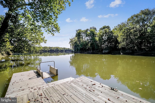 dock area featuring a water view
