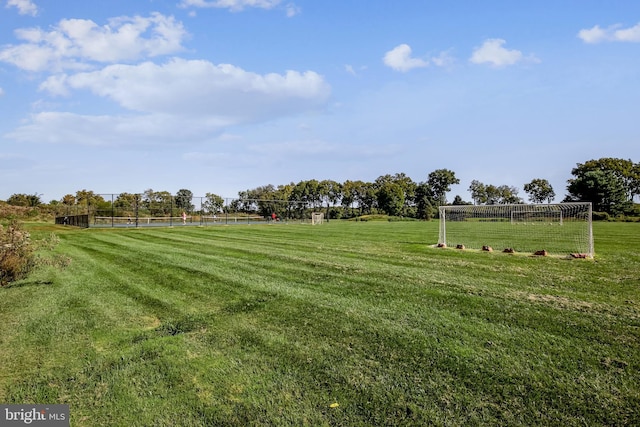 view of home's community featuring an area for sports and a rural view