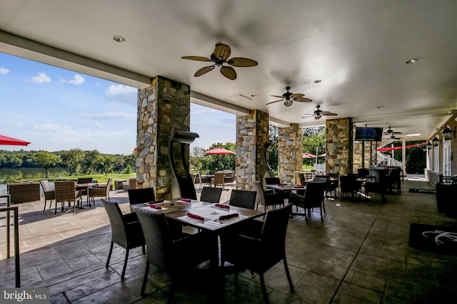 view of patio / terrace with outdoor dining area and ceiling fan
