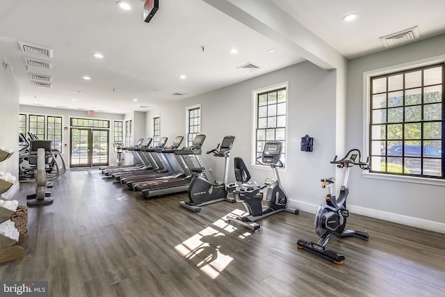 workout area featuring wood finished floors, recessed lighting, baseboards, and french doors