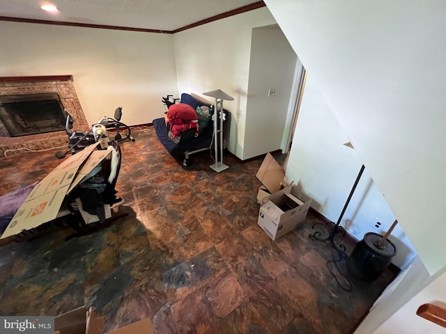 interior space with crown molding, a brick fireplace, and stone finish flooring