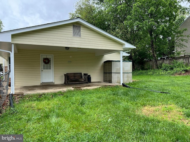 back of house with a yard and fence