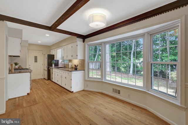 4303 S Valiant Ct, Annandale, VA 22003 - kitchen featuring a sink, dishwashing machine, white cabinetry, light wood-type flooring, and recessed lighting