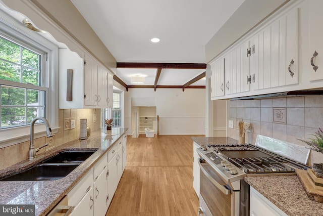 4303 S Valiant Ct, Annandale, VA 22003 - kitchen featuring stainless steel range with gas stovetop, a sink, light wood finished floors, white cabinetry, and recessed lighting