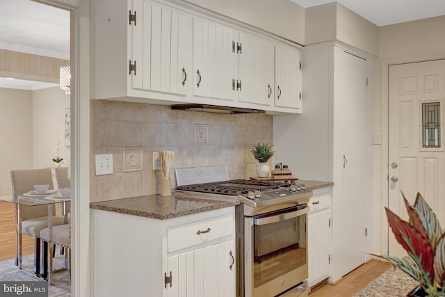 4303 S Valiant Ct, Annandale, VA 22003 - kitchen featuring stainless steel gas range oven, light wood-style floors, tasteful backsplash, white cabinets, and under cabinet range hood