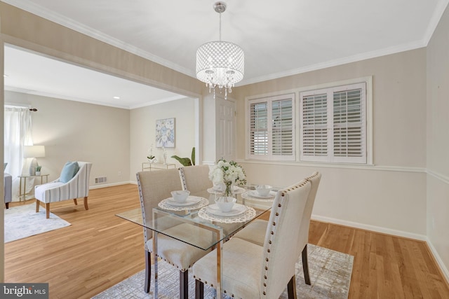 4303 S Valiant Ct, Annandale, VA 22003 - dining room with a chandelier, wood finished floors, baseboards, and crown molding
