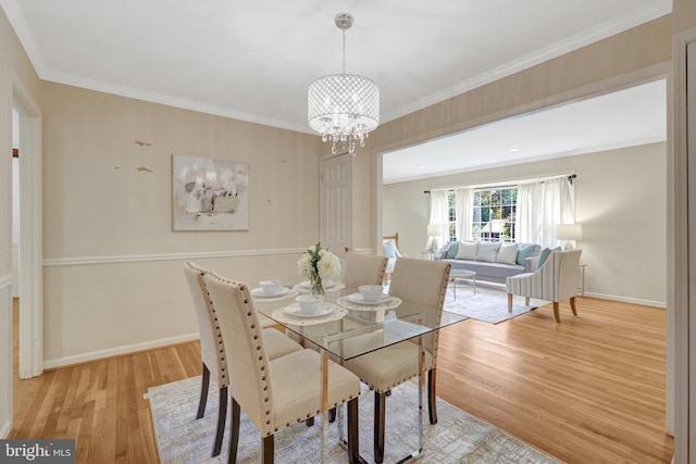 4303 S Valiant Ct, Annandale, VA 22003 - dining area with light wood-type flooring, a chandelier, baseboards, and crown molding
