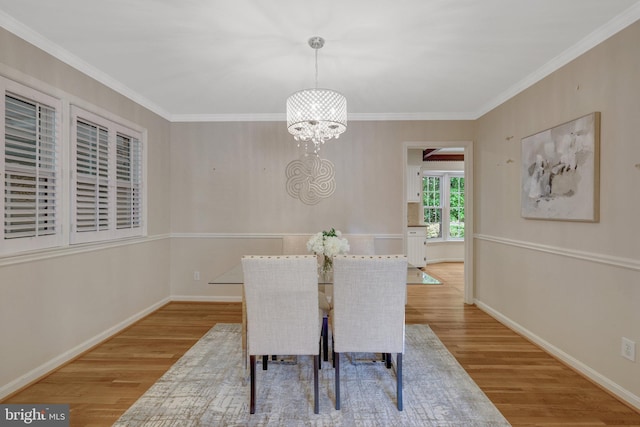 4303 S Valiant Ct, Annandale, VA 22003 - dining area featuring light wood finished floors, a chandelier, crown molding, and baseboards